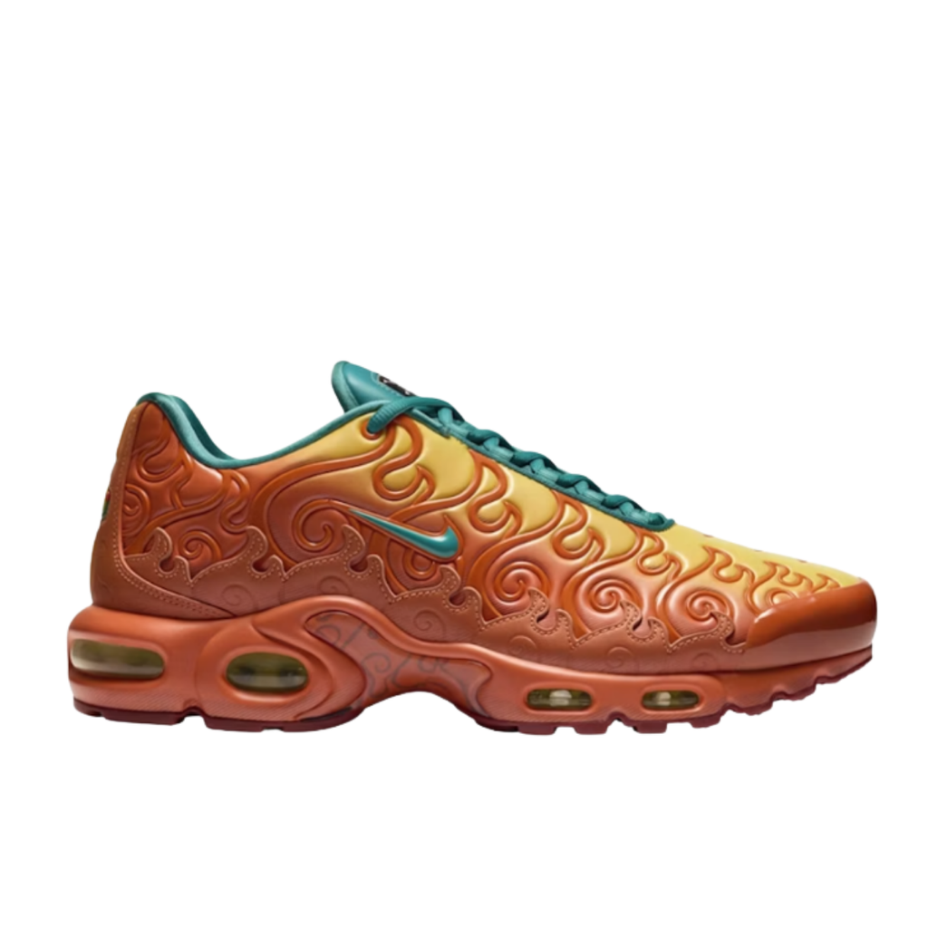 A Nike Air Max Plus sneaker featuring a flame gradient design transitioning from yellow to orange and brown, with embossed swirl patterns and teal accents on the Swoosh, laces, and collar.