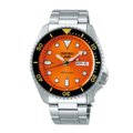 A Seiko automatic watch with a silver stainless steel link bracelet, a bright orange dial, and a black rotating bezel with yellow markings, shown against a plain white background.