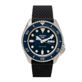 A Seiko dive watch with a deep blue dial, silver stainless steel case, and a black textured silicone strap, shown against a plain white background.